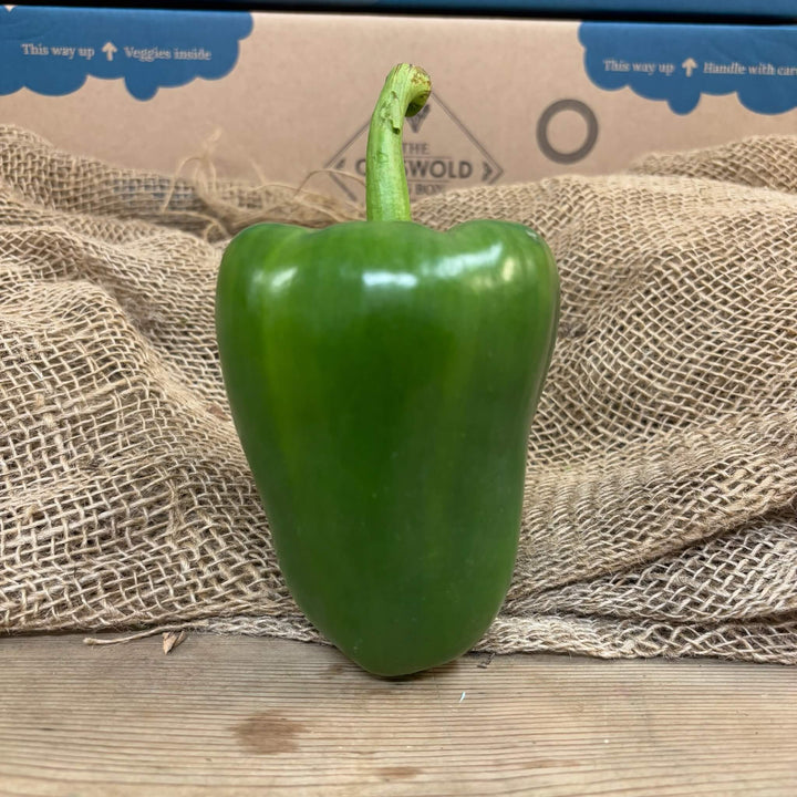A whole green pepper.