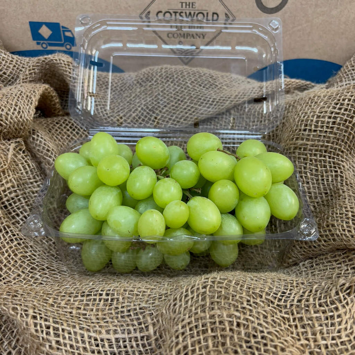 A punnet of white grapes.